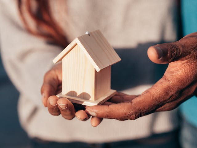 people-holding-mini-house people-holding-mini-house
